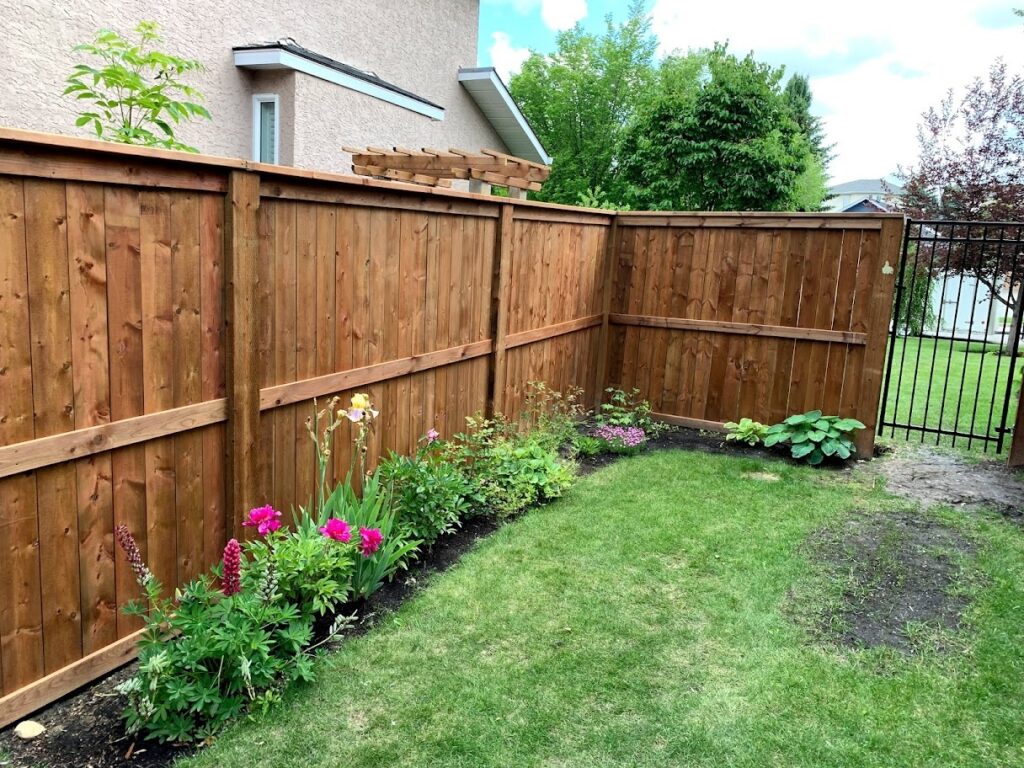 The Benefits of Adding Flower Beds to Your Fence