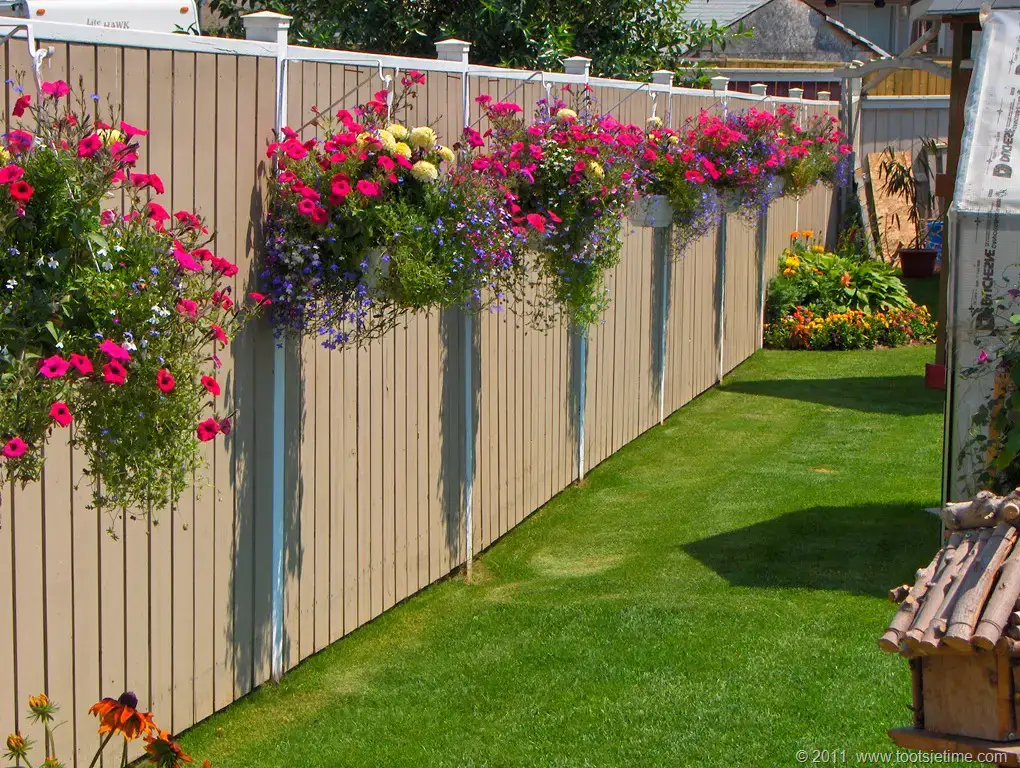 The Benefits of Adding Hanging Planters to Your Fence